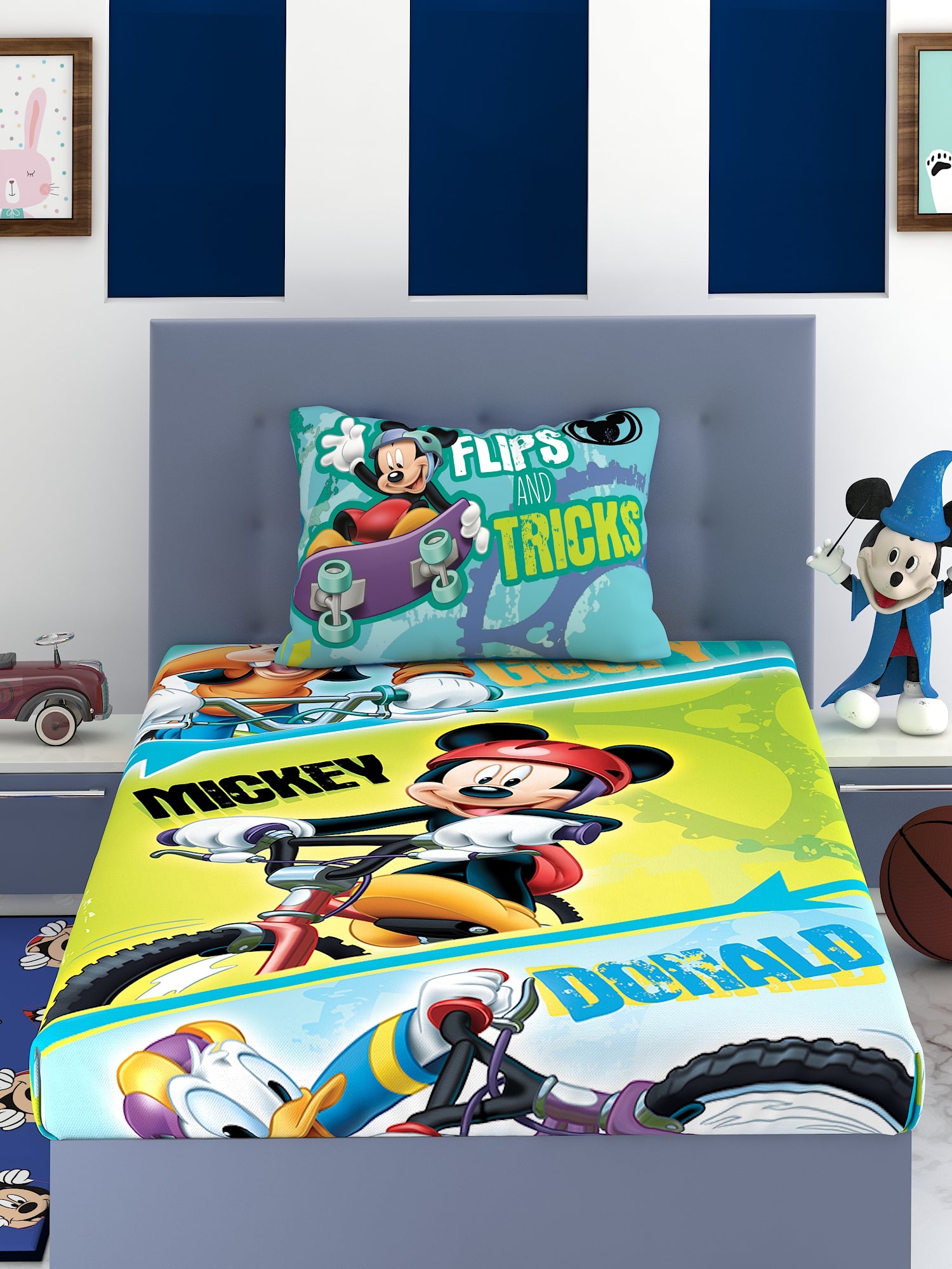 a bed with a colorful comforter and pillows