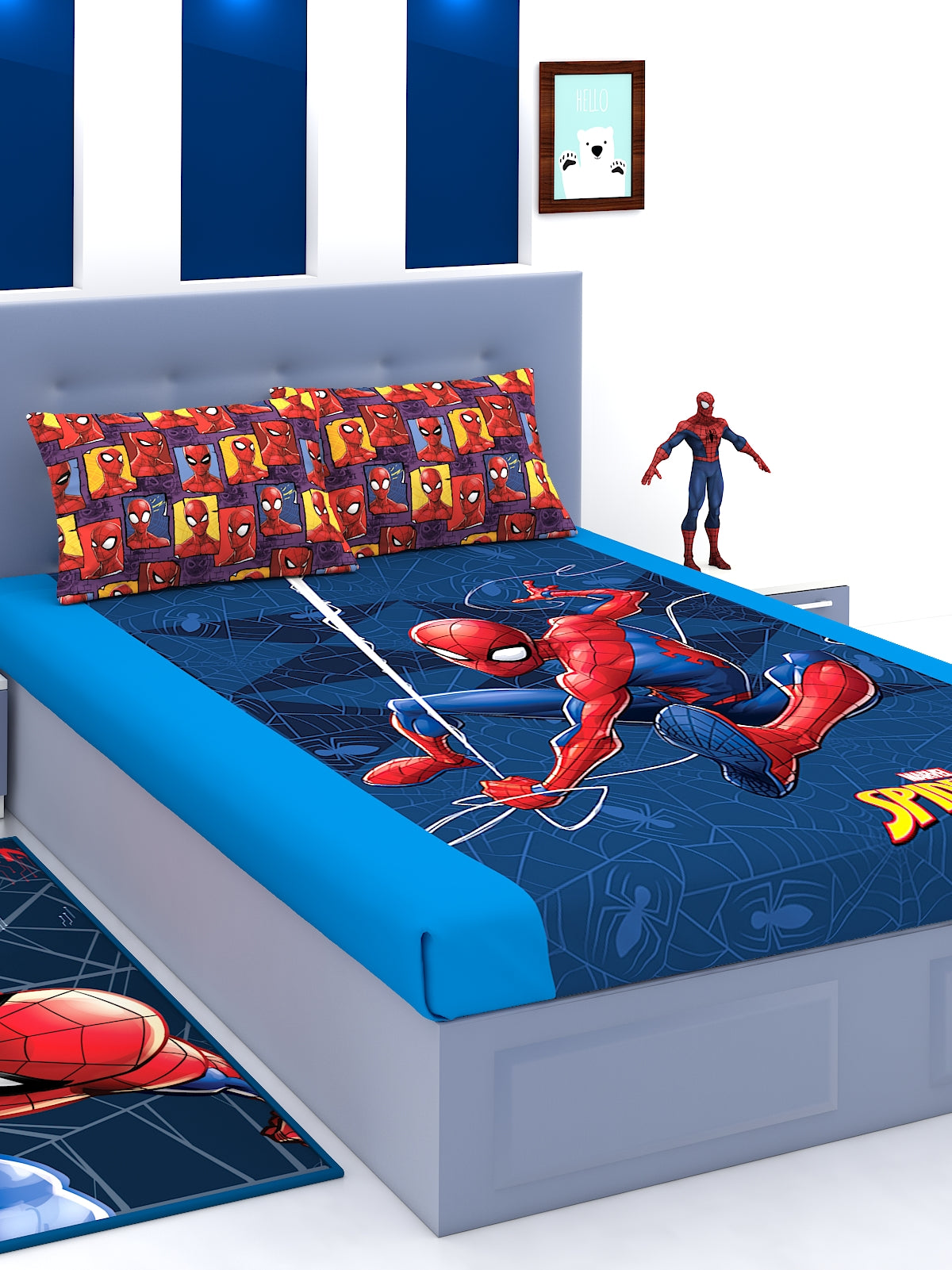 a bed with a blue blanket and a blue pillow