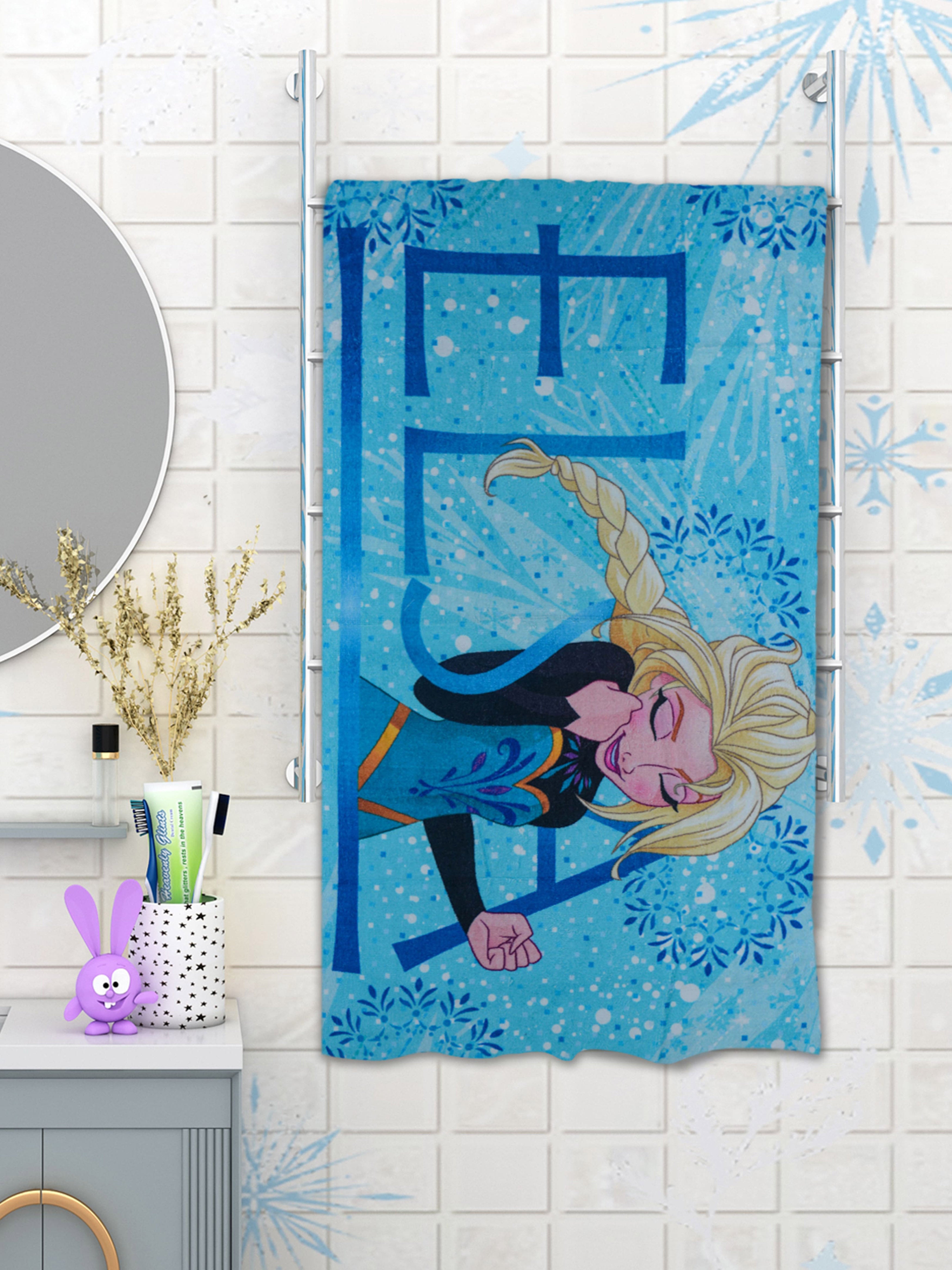 Athom Living Disney Frozen Elsa Blue Kids Cotton Bath Towel 350 GSM 60x120 cm designed with vibrant prints and high absorbency. This bath towel offers softness, durability, and fun for young Frozen fans after every bath.
