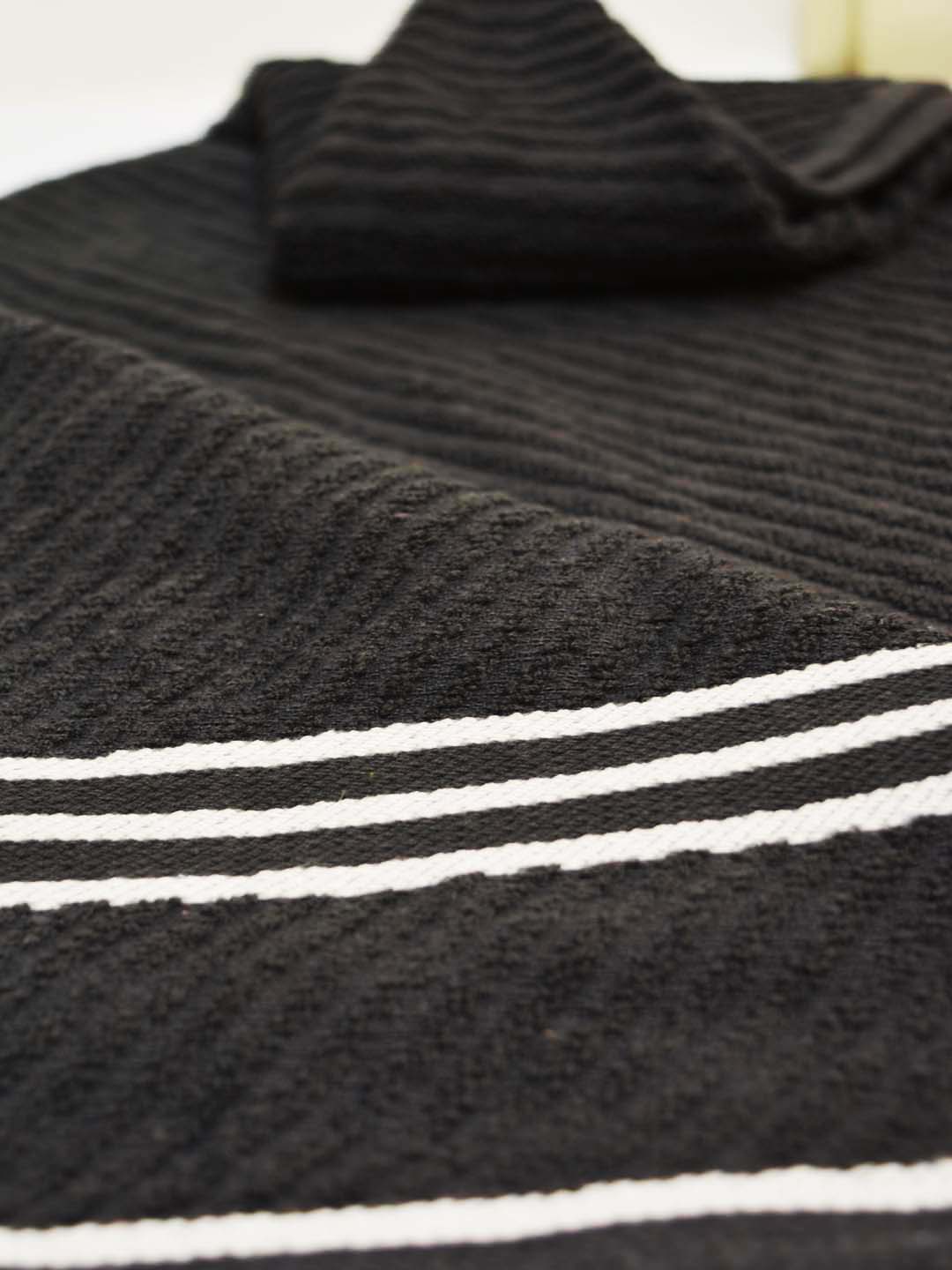 Athom Living Pack of 4 Terry Towels with diagonal stripe pattern, soft, quick-dry, durable cotton towels perfect for everyday bathing and bathroom essentials.