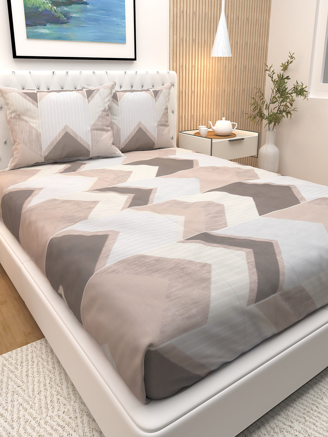 Athom Living Premium Bloom double bedsheet featuring modern brown arrow stripe patterns, paired with two pillows, offering a soft, durable bedsheet ideal for contemporary home interiors.