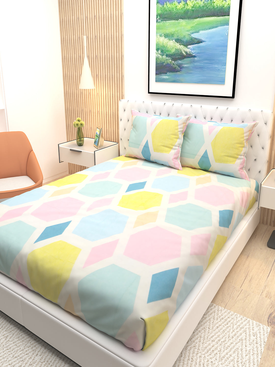 Athom Living marigold hexagonal double bedsheet arranged with two pillows, highlighting soft material, bold prints, and a modern bedsheet pattern that enhances any bedroom’s visual appeal effortlessly.