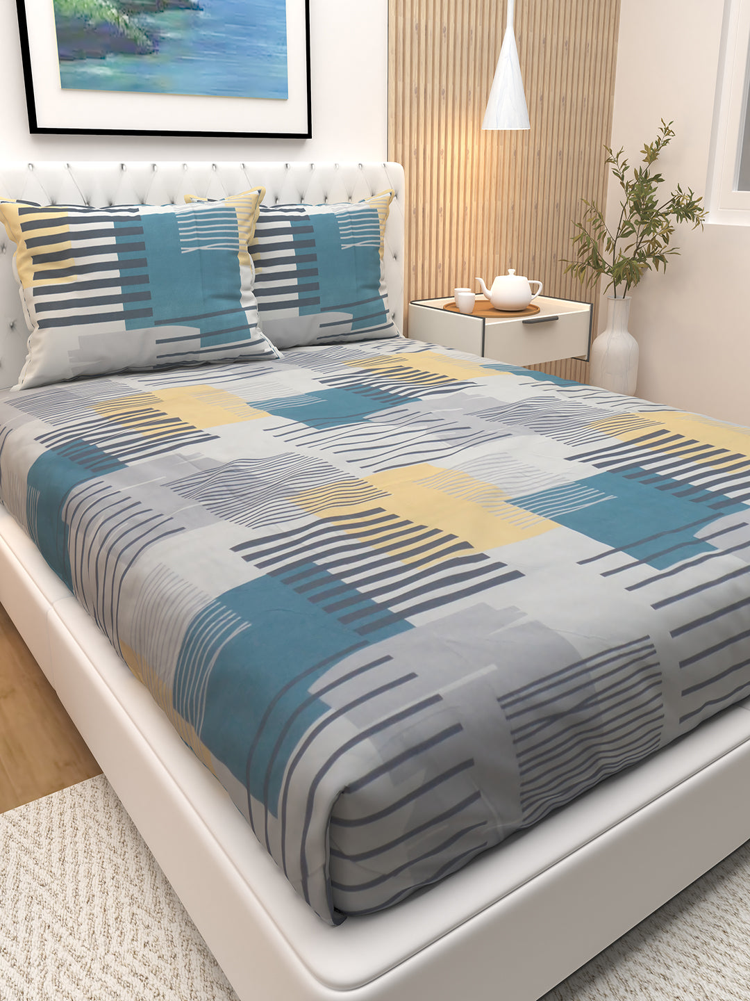 Beautiful Blossom Blue Stripes bedsheet with two pillows by Athom Living, styled on a double bed, highlighting premium fabric quality, smooth texture, and fresh blue tones ideal for enhancing bedroom style.