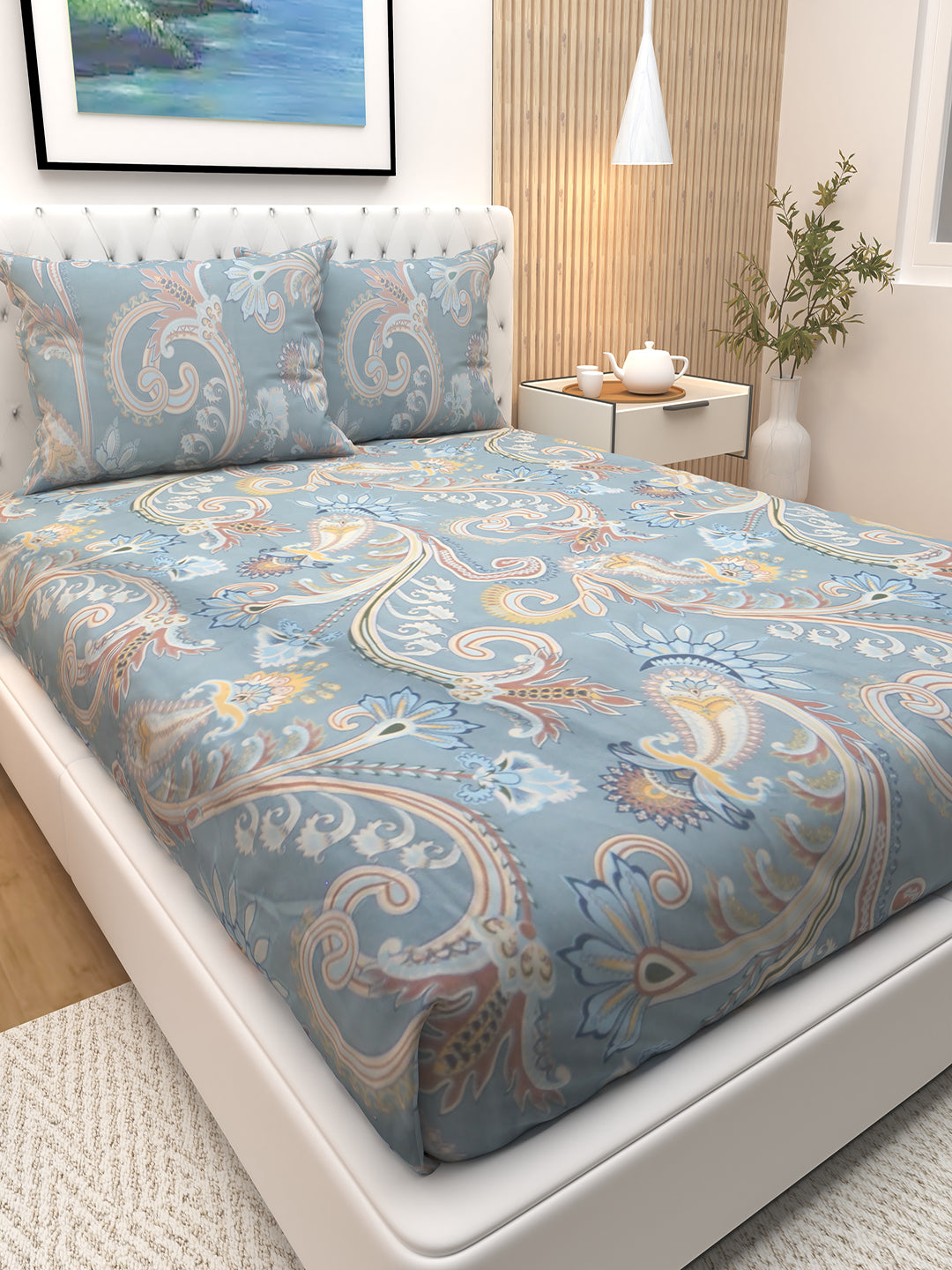 Beautiful premium blue floral double bedsheet by Athom Living displayed with two pillows, showcasing soft fabric and elegant prints. This bedsheet elevates bedroom style with comfort and long-lasting quality.