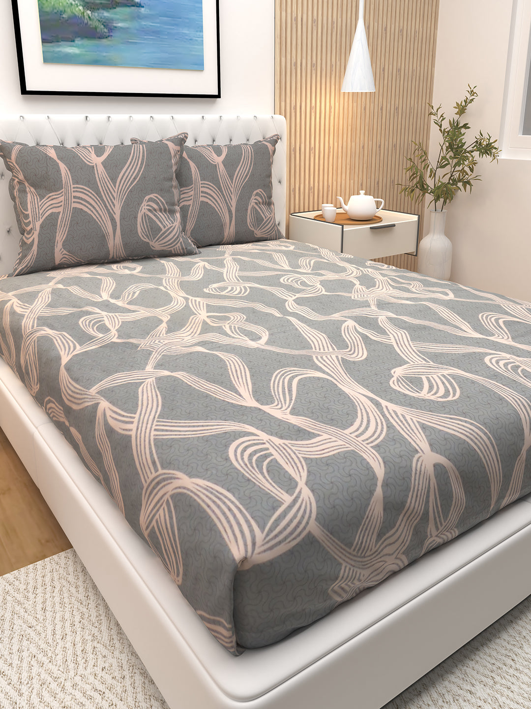 Elegant cream and grey striped botanical double bedsheet by Athom Living with two pillows, crafted for luxury comfort and a stylish bedroom look, perfect for enhancing interiors with a premium bedsheet finish.