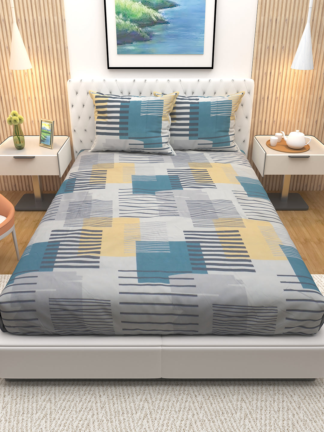 Premium Blossom Blue Stripes double bedsheet by Athom Living displayed neatly with two matching pillows, showcasing soft fabric, elegant stripe design, and vibrant finish perfect for modern bedroom décor and comfort.