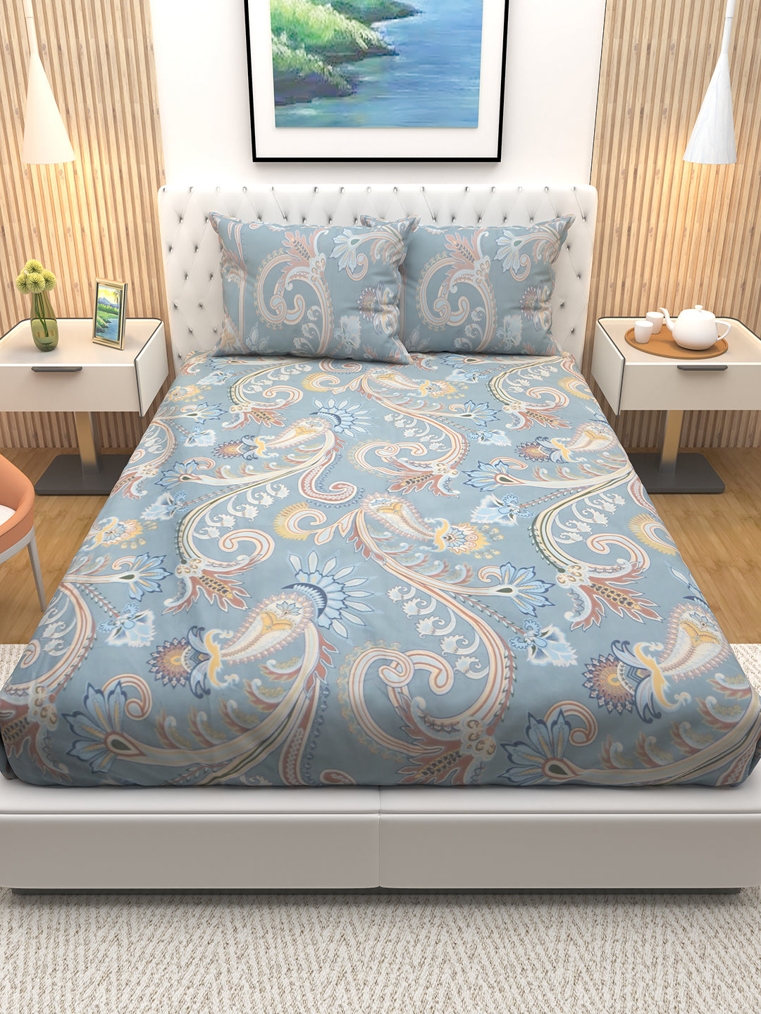 Premium blue floral printed double bedsheet by Athom Living, styled with two matching pillows, made to enhance bedroom décor. This elegant bedsheet adds comfort, vibrant design, and a refreshing look to your space.