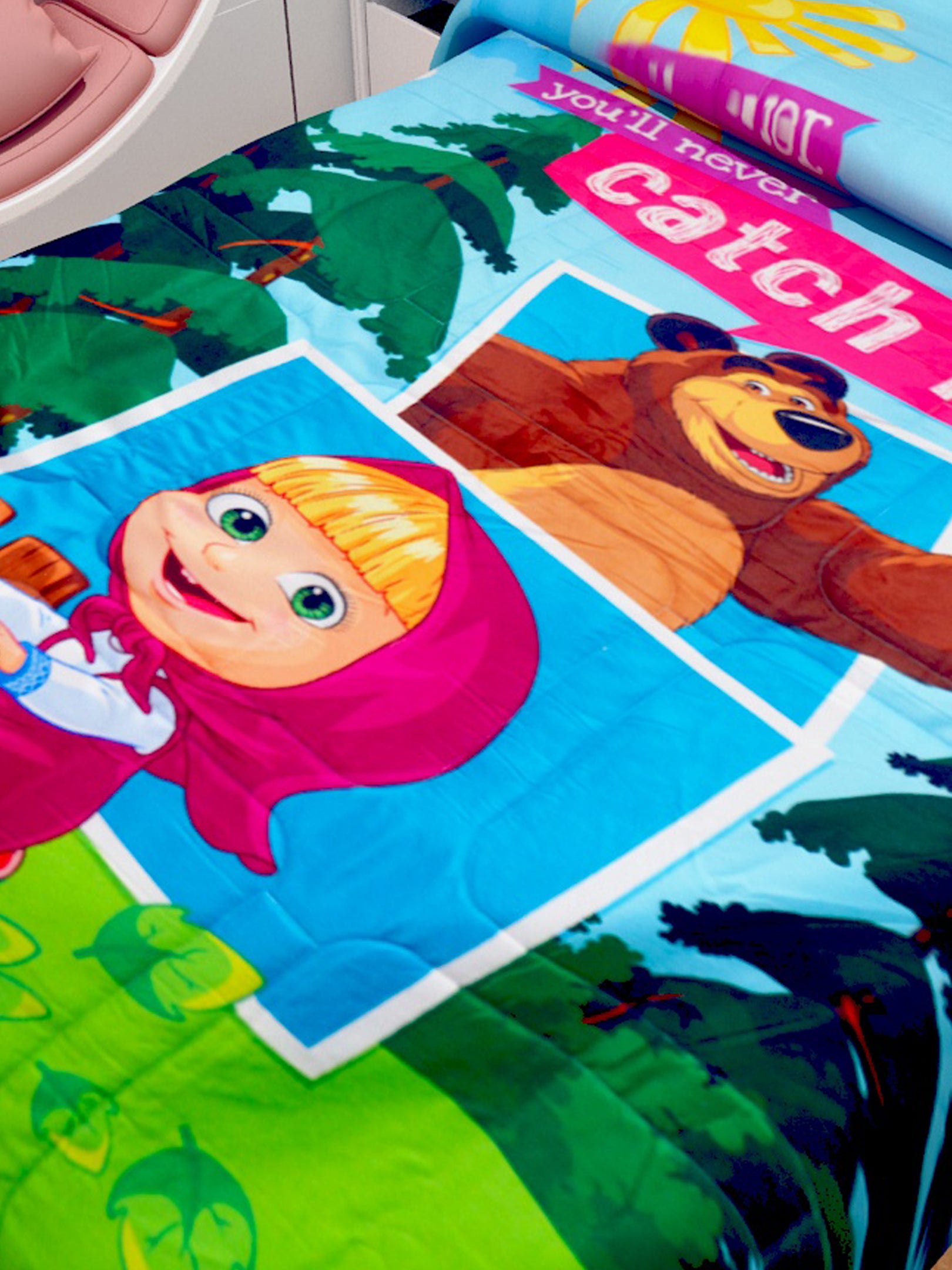 Single size kids comforter featuring Masha & The Bear, “You Will Never Catch Me” design by Athom Living, soft, durable, and fun for kids.