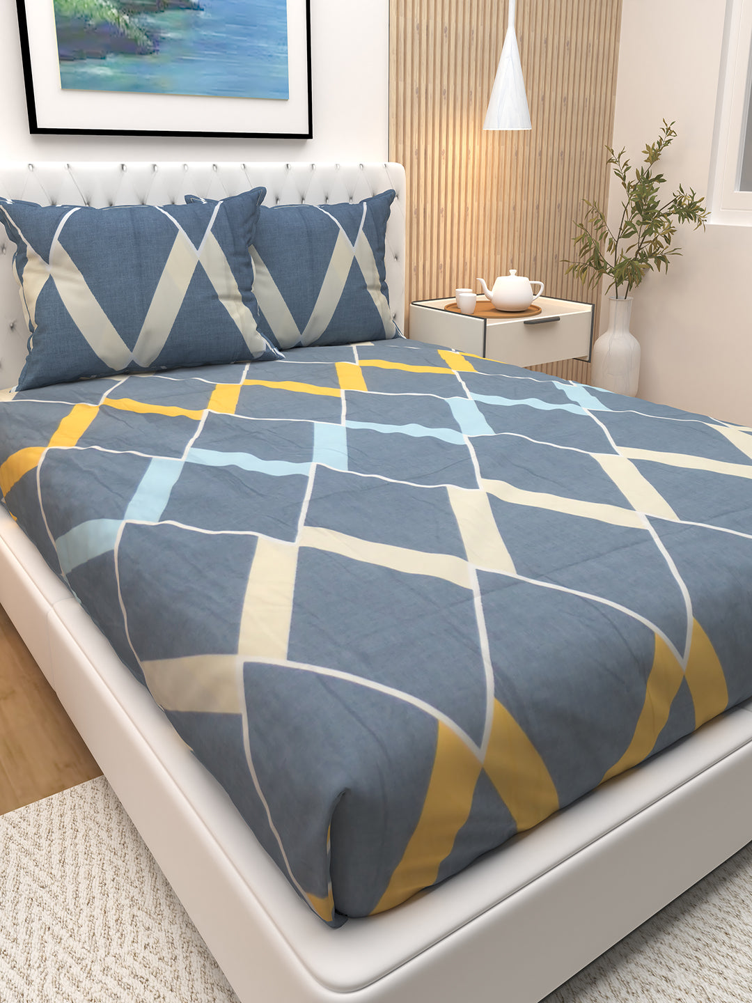 Spiky Blue Diamond Print luxury double bedsheet by Athom Living featuring two soft pillows, crafted with premium fabric for a stylish bedroom upgrade and a comfortable, skin-friendly sleeping experience.