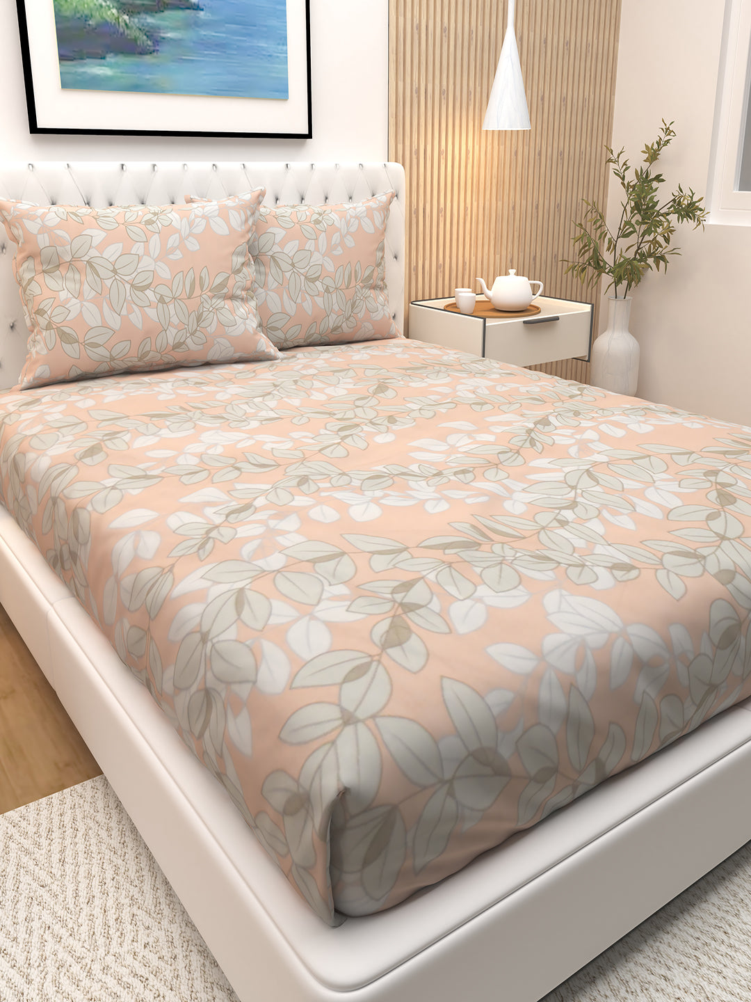 Stylish pink and grey leaves printed double bedsheet by Athom Living featuring two coordinated pillows, offering a premium, soft-touch bedsheet ideal for creating a calm and beautiful bedroom setting.