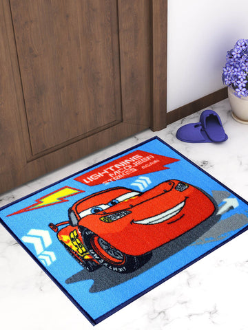 a table with a rug and a pair of scissors on it 