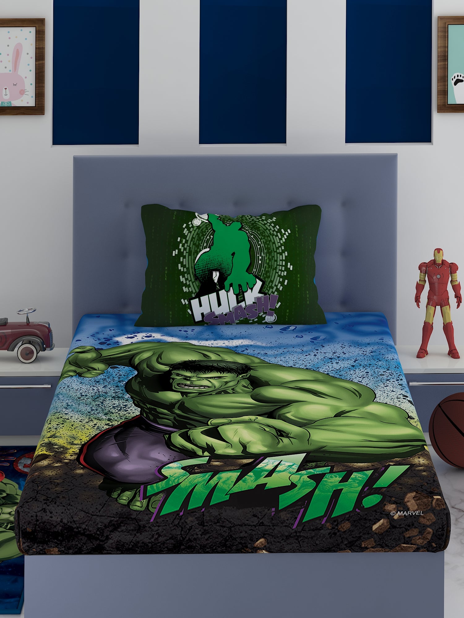 a bed in a room with a green couch 
